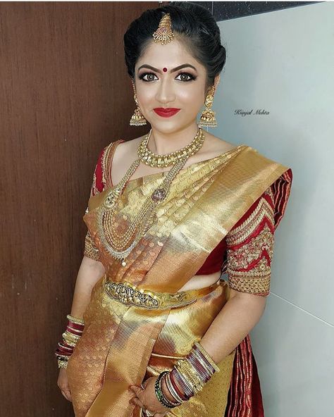 A perfect bridal look created by @makeupstudio_academy_bykiinjal ! She is professional makeup artist in Bangalore! For bookings! Contact-… Dress Designs From Saree, Golden Saree With Contrast Blouse, Saree With Contrast Blouse, Gold Saree, Golden Saree, Indian Bridal Sarees, Wedding Saree Blouse, Saree Blouse Neck Designs, Wedding Saree Blouse Designs