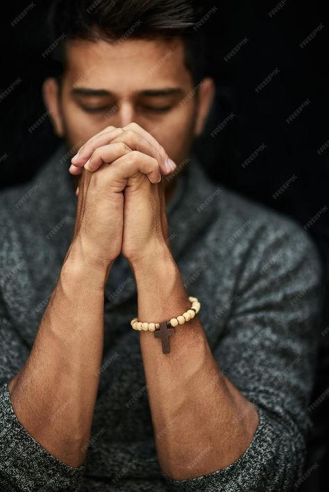 Premium Photo | His faith is strong closeup shot of a young man praying with his eyes closed