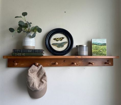 Best Interior Design Tips: Adopting the Cottagecore Aesthetic with These 12 Items - InspiredLiving Wooden Peg Rail, Towel Rack Kitchen, Coat Rack Entryway, Peg Rail, Shelf With Hooks, Peg Rack, Shaker Pegs, Entryway Shelf, Cottagecore Home