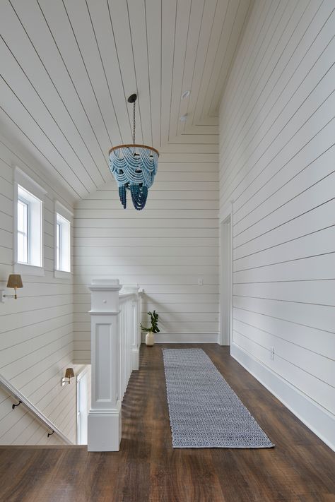 If you've followed me for a while now, you know I like to treat #staircases as their own room.⁠ ⁠ Here I added windows across the wall which acts like artwork and brightens the entire space. The high ceilings create a lot of volume that is highlighted by this amazing #OmbreWoodBeadChandelier by #ReginaAndrewDetroit. ⁠ ⁠ ⁠ #MarnieCustomHomes⁠ #BeachHappyTour⁠ #MarnieOursler #shiplap #staircase #staircasedesign #vaultedceilings #cathedralceilings #bluechandelier Coastal Staircase, Bedroom 2025, Ge Cafe Appliances, Stair Nook, Bunk Bed Sets, Custom Bunk Beds, Coastal Glam, Shiplap Ceiling, Ship Lap