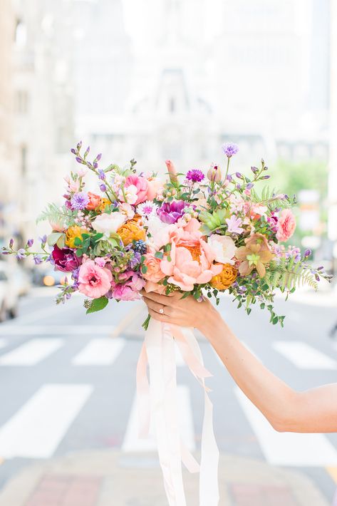 Colorful Spring Bridal Bouquet in front of City Hall in Philadelphia.  Includes peonies, tulips, ranunculus, hellebores, and more. Designed by Love 'n Fresh Flowers. Spring Bridal Bouquet, Rustic Spring Wedding, Bridal Bouquet Spring, Spring Wedding Bouquets, Spring Wedding Bouquet, Spring Wedding Inspiration, Sustainable Wedding, Spring Wedding Flowers, Bouquet Design