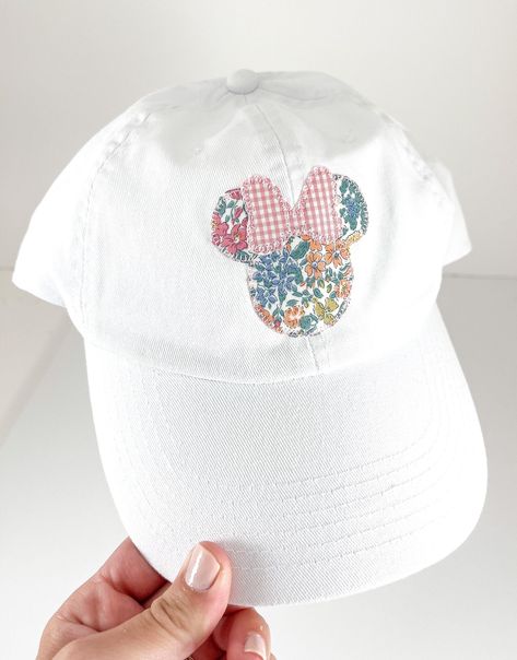 "WELCOME TO HADLEY AND FINN  Product Details: Girl Mouse Ears on Children or Adults White Hat  Applique Description: Floral Girl Mouse Ears with Pink Gingham Bow  Product Sizing:   Children Fits Ages 2T - 10, and Adults                                Children's Hat is adjustable: head circumference measures 20\" - 24\"  Product Care:  We do not recommend washing Order Processing Time: Listed in Shipping Options  Social Media: Follow us on Instagram Contact The Owners: Send us a conversation on E Hand Stitched Disney Shirt, Disney Applique Shirts, Disneyworld 2024, Disney Applique, Disney 2023, Bow Applique, Magical Boy, Disney 2024, Magical Accessories