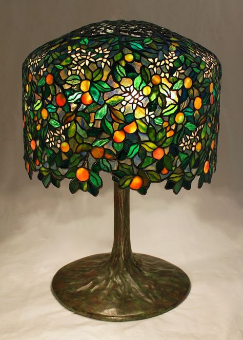 18″ Calamondin Orange Tree lamp. The lamp is an original Century Studios lamp design by Bill Campbell (see the previous post for our design inspiration). The lamp was designed to utilize the Tiffany 18″ Wisteria crown and form, and is now in a private Midwest collection. With just under 2050 individual... Tiffany Stained Glass Lamps, Tiffany Glass Lamp, Tiffany Lamp Aesthetic, Calamondin Orange Tree, Fun Lamps, Interesting Lamps, Bill Campbell, Glass Trees, Lamp Inspiration