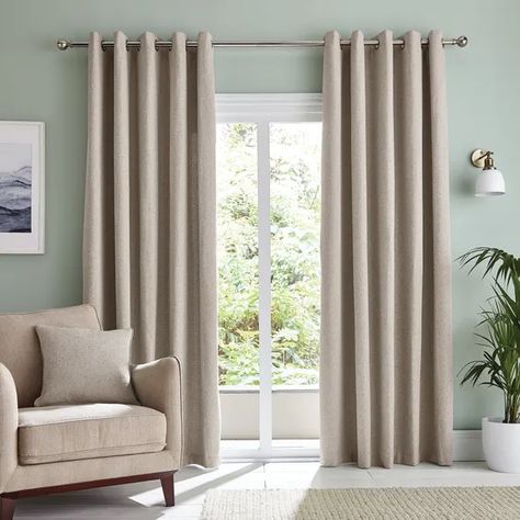 Beige curtains and a beige club chair in an elegant living room with light green walls. Curtains To Match Green Walls, Beige Curtains Living Room, Lounge Curtains, Green Walls Living Room, Blue Sofas, Curtains Style, Light Green Walls, Beige Curtains, Ceiling Curtains