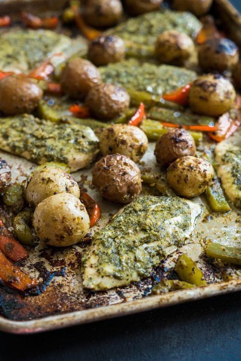 Sheet Pan Pesto Chicken and Veggies Pesto Chicken Thighs, Sheet Pan Pesto Chicken, Potatoes And Bell Peppers, Pesto Chicken Breast, Baked Pesto Chicken, Pesto Potatoes, Greek Dinners, Mini Potatoes, Sheet Pan Suppers