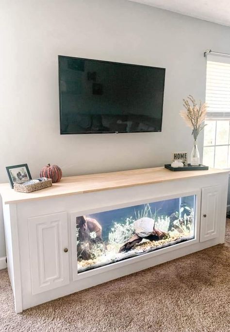 Fish Tank In Entryway, Living Room With Fish Tank Ideas, Fish Tank Home Decor Living Rooms, Fish Tank Furniture Ideas, Entertainment Center With Fish Tank, Tv Cabinet With Aquarium, Aquarium Tv Stand, Fish Tank Stand Ideas Living Rooms, Fish Tank Entertainment Center