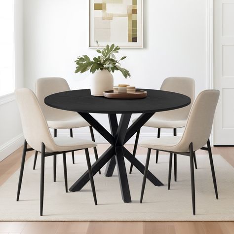 Introducing the Black Dining Table Set for 4, a perfect addition to shake up your natural palette and add a contemporary touch to your dining space. This set features a cool and modern design that will surely catch the eye. The dining table boasts a spray look leg made of solid metal, providing both style and durability. The heavy base ensures a substantial foundation, guaranteeing stability for the pedestal base. With dimensions of 39.5'' L x 39.5'' W, this table is an ideal size for apartments Black Round Dining Table Styling, Dining Table Small Spaces, Round Table Kitchen Decor, Dining Room Table In Small Space, Chair And Table Design, Black Dining Room Furniture Color Combos, Dinette Area Ideas, Modern Minimal Dining Table, Small Modern Kitchen Table