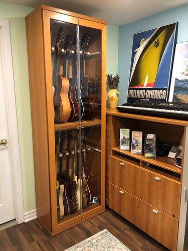 Armoire1 | Oldschool59 | Flickr Storage For Musical Instruments, Storing Guitars At Home, Studio Guitar Room, Instrument Case Storage, Music Collection Display, Ikea Guitar Display, Guitar Practice Room, Instrument Storage Ideas Music Rooms, How To Store Guitars