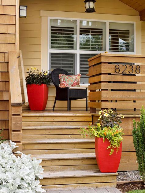 Use fun containers to spruce up your home’s outdoor appearance. More curb appeal on a dime: http://www.bhg.com/home-improvement/exteriors/curb-appeal/curb-appeal-on-a-dime/?socsrc=bhgpin081113flowercontainers=1 Cheap Front Doors, Exterior Door Trim, Wood Deck Railing, Front Porch Railings, Front Porch Steps, Deck Railing Design, Diy Curb Appeal, Balkon Decor, Stairs Ideas