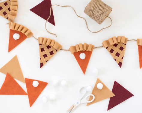 "A cute and fun way to decorate your home every Thanksgiving! Display on your stair case or mantle for a fun addition this Fall. Each garland includes 4 felt pumpkin pie banners with approximately 1\" white pom poms, and 5 lattice topped berry pies for a total of 9 4\" x 4.5\" triangle flag pie slices. Made with 1mm twine and looped ends for easy hanging. Overall length is approximately 5ft in length with  2\" between each flag." Pie Banner, Thanksgiving Pie, Pumpkin Pies, Fall Banner, Thanksgiving Pies, Berry Pie, Pumpkin Fall Decor, Felt Projects, Felt Garland