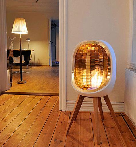 Piet Indoor Stove (concept): This beautiful fireplace / stove by Fredrik Hylten- Cavallius is as lovely as it is functional. It features brass reflectors making the whole room warm up instantly, and the fire is powered by ethanol, eliminating the need for a chimney. Modern Fireplaces, Portable Fireplace, Ethanol Fireplace, Indoor Fireplace, Wooden Floor, Fireplace Design, Style At Home, Electric Fireplace, Wood Stove