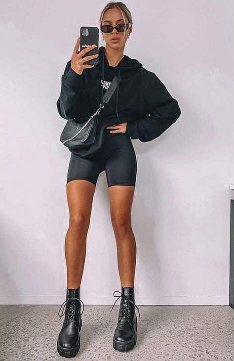 Biker Shorts Game Day Outfit, Shorts And Chunky Boots, Bike Shorts And Doc Martens, Biker Shorts Long Sleeve Outfit, Biker Shorts Combat Boots Outfit, Biker Shorts Airport Outfit, All Black Biker Shorts Outfit, Effortless Shorts Outfit, Trendy Biker Shorts Outfit