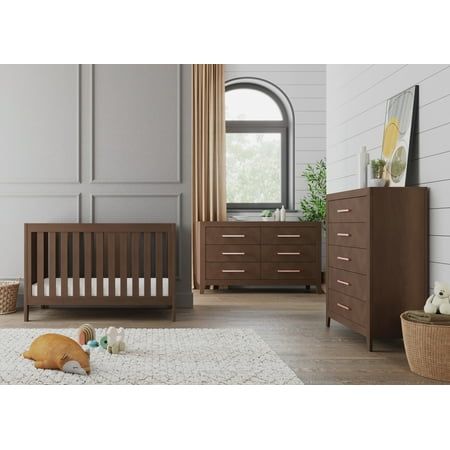 The transitional-yet-modern design of the Child Craft Kieran furniture collection creates a beautiful, sophisticated feel in any nursery. This 3-piece nursery set includes the Kieran Euro 3-in-1 Convertible Crib, the Kieran Double Dresser, and the Kieran Chest. The Kieran collection is available in 2 sophisticated finishes: Toasted Chestnut and Crescent Gray. The gentle herringbone patterned sideboards paired with the angled geometry of the mitered corners and tapered legs creates a unique style Patterned Headboard, Dresser And Chest, Changing Table Topper, Bed Rails For Toddlers, Nursery Furniture Collections, Toddler Beds, Dresser Sets, Crib Bumper, Baby Bassinet