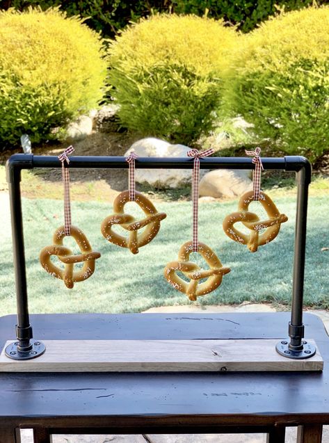 I have an easy tutorial for you on how to make a hanging pretzel bar! This will also work for donuts and bagels and party favors as well! With a few supplies from a hardware store, some easy drilling and spray paint, you’ll have a great presentation and centerpiece for your next gathering! I love […] Pretzel Stand, Pretzel Bar, Pretzel Bars, Fall Entertaining, Great Presentations, Fall Party, Diy Party Decorations, Hardware Store, Bagels