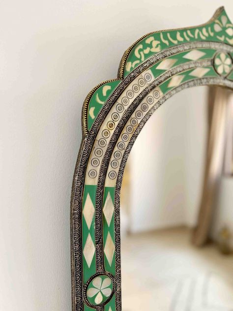 Vintage Moroccan Mirror | Arch Bone inlay Wall Mirror, Green Frame Mirror, Bathroom Mirror, living room Mirror, Bedroom Mirror , Home DecorStep into a world of exotic elegance with our luxury Moroccan wall mirror. Carefully crafted by our team of skilled artisans, this breathtaking piece is a stunning fusion of bone and brass, showcasing intricate Berber and Moroccan engravings that evoke the rich cultural heritage of North Africa.The solid bone frame is adorned with intricate Berber engravings Standing Mirror In Living Room, Marocco Interior Design, Frame Mirror Bathroom, Arch Mural, Tile Mirror Frame, Heritage Decor, Mirror Arch, Arch Wall Mirror, Mosaic Mirror Frame