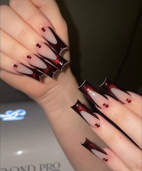 Red Masquerade Nails, Dark Red Prom Nails Acrylic, Black And Red Crown Quinceanera, Black French Tip Red Gems, Black And Red Nails With Rhinestones, Gothic Red And Black Nails, Baddie Nails With Rhinestones, Black Silver And Red Nails, Black Nails Red Gems