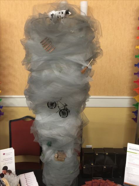 “Wizzard of Oz” themed conference - I built a tornado that actually rotates (circles around & around) out of a tomato cage, tulle & rotating display disc How To Make A Tornado Decoration, Tornado Balloons, Tornado Pinata, Twister Movie Themed Party, Diy Tornado Decoration, Tornado Party Decorations, Tornado Birthday Party Ideas, Tornado Party Ideas, Tornado Decoration