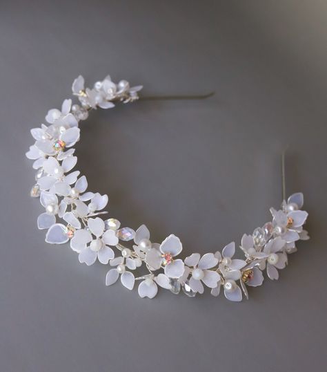 Bridal headband floral, Bridal headband, Wedding headband, Bridal flower headband, Wedding headband for bride, Bride headband for wedding This exquisite wedding blossom headpiece is a perfect choice for a modern bride! It looks great even if you are keeping long curls or straight hair.  The accessory is attached to a silver headband for a secure fit. The flowers are made of UV resin, that is the new trend in handmade jewelry. Each petal is created manually.  - Flexible, easily adjustable, stiff Wedding Headpieces, White Wedding Jewelry Headband, Handmade Wedding Jewelry Headband, Fantasy Wedding Headband, Whimsical White Wedding Headband, White Floral Headband, Bridal Flower Headband, Bride Headband, Bead Hair Accessories