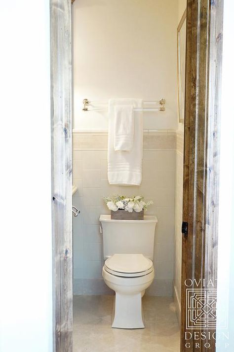 Lovely bathroom boasts a lucite and brass double towel holder placed over toilet. Towel Bar Placement In Bathroom, Towel Bar Above Toilet, Towel Bar Over Toilet, Bathroom Towel Bar Placement, Towel Rack Above Toilet, Towel Bar Placement, Bar Design Ideas, Above Toilet, Wall Towel Racks