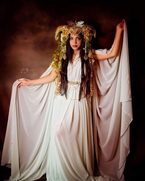 Get a costume fit for a goddess with these Greek mythology-inspired ideas. How about the goddess of wine, for starters? #halloween #halloweencostume #halloweencostumeideas #costumeideas #greek #goddess #goddesscostume #halloweenfashion #halloweenbeauty Goddess Costumes For Women, Pandora Costume Greek, Selene Goddess Costume, Goddess Cosplay Ideas, Greek Muses Costume, Wine Goddess Costume, Diy Greek Goddess Costume For Women, Greek Gods Party Theme Goddess Costume, Halloween Costumes Greek Mythology