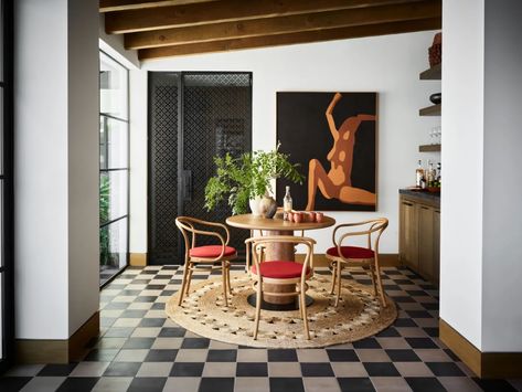 Lucas Interior Embraces Color to Modernize a Palm Springs Spanish Revival Home | Architectural Digest Mission Revival Homes, Checkerboard Floors, Blue Side Table, Spanish Revival Home, Apartment Dining Room, Checkerboard Floor, Apartment Dining, Freestanding Fireplace, Timber Beams