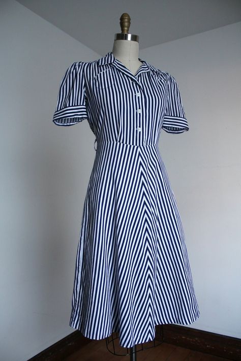 "Adorable blue chevron striped dress from the late 1930s / early 1940s. This one has snaps on the side.  Label: none - likely homemade Measurements: { small } Bust: up to 38\" (I think meant to be blousy)  Waist: 26\"  Hips: 38\" Length: 41.5\" Sleeve Length: 11\" Condition: great vintage condition with some issues to note: severe fading along shoulder / sleeve and sides of dress, the stitching around the pocket bled a hint and one thread was loose on this one and sadly left a color bleed mark. 1930s Fashion America, Early 1930s Fashion, 1940s Dresses Casual, 1930s Summer Fashion, 1930s Outfits For Women, 1930 Fashion Women, 1930s Day Dress, 1940s Patterns, 1930s Clothes