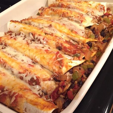 Black Bean and Rice Enchiladas Recipe | Allrecipes Rice Enchiladas, Brown Rice Recipes Healthy, Black Bean And Rice, Healthy Brown Rice, Bean And Rice, Vegetarian Casserole, Black Bean Enchiladas, Vegetarian Enchiladas, Black Beans And Rice