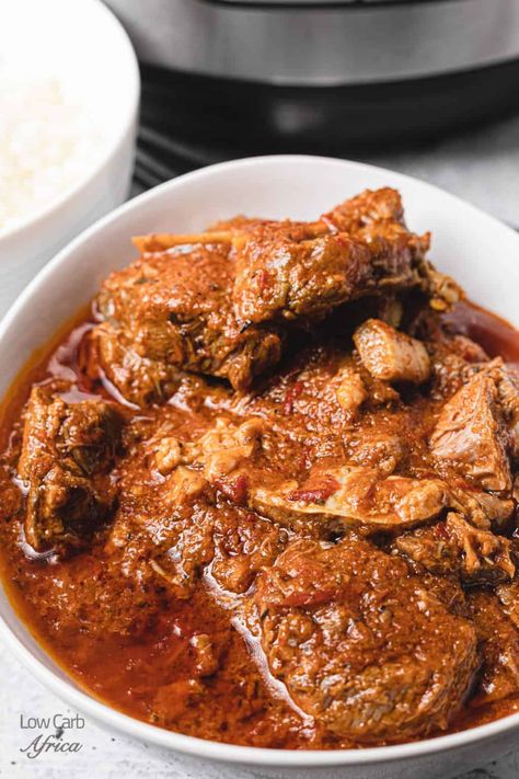 If you crave something warm and comforting, this instant pot African lamb stew is what you need! Make with tender lamb chunks, veggies, and aromatic spices, this hearty stew will become a family favorite! #lowcarb #lowcarbrecipe #ketorecipe #ketodiet #lchf #paleo #africanrecipes #africanketo | LowCarbAfrica.com Nigerian Lamb Stew, Stewed Lamb Recipe, African Lamb Stew, Goat Stew Recipe, Turkey Stew, Lamb Stew Recipes, Lamb Loin Chops, Hearty Stew, African Foods