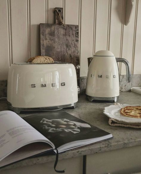 Embrace calm mornings with the perfect breakfast duo - the SMEG 50’s Style toaster and electric kettle. From crispy toast to perfectly brewed tea, make every morning count. ☕🍞 Pictured: 1️⃣ 50’s Style Two-Slice Toaster, Cream, TSF01CRUS 2️⃣ 50’s Style Electric Kettle, Cream, KLF03CRUS #FortheloveofSmeg #AtHomeWithSmeg #SmegCanada Cream Kettle, Rustic Cottage Kitchens, Smeg Kettle, Smeg Toaster, Kitchen Decoration Ideas, Smeg Kitchen, Kitchen Ideas Decoration, Black Countertops, Kettle And Toaster