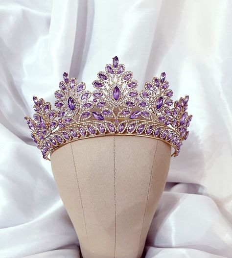 Beautiful lavender lilac purple crown with Austrian crystals and gold metal. This purple tiara Shines radiantly Perfect for weddings, pageants, quinceanera, birthdays or any special occasion. Comes beautifully packaged in a pouch. ships out within 1 day Purple Quinceanera Jewelry, Lavender Quinceanera Crown, Purple Quinceanera Crowns, Purple Gold Jewelry, Lavender And Gold Quinceanera, Purple And Gold Quinceanera Theme, Lavender Quinceanera Decorations, Lavender Quinceanera Ideas, Purple Quinceanera Theme