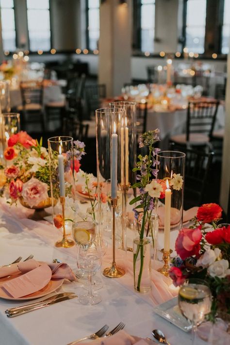 modern wedding colorful florals and candles | Image by Elvira Kalviste Long Table Decor For Wedding, Wedding Table Centerpieces Summer, Summer Wedding Ideas Indoor, Wedding In August, August Wedding Decorations, Reception Wedding Decorations Indoor, Wedding Themes Indoor, Wedding Venue Decorations Indoor, Long Table Wedding Decor