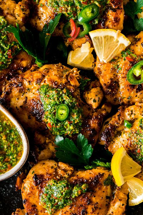 Chicken Thighs with Chimichurri Sauce served on a black plate Chimichuri Sauce, Chicken Thigh Marinade, Chimichurri Chicken, Pork Medallions, Chicken Flatbread, Roasted Chicken Thighs, Beef Strips, Chilli Peppers, Chimichurri Sauce