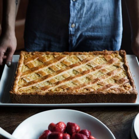 Italian wheat piesfilled with a rich ricotta custard studded with tender wheat berriesare associated with Easter celebrations, but according to author Gina Marie Miraglia Eriquez, rice pies are just as classic and in her estimation, taste better. Eriquez had been making wheat pies for years when she had some extra dough a while back and used it to make a rice pie. "My family went berserk. They went crazy for it!" said Eriquez with a laugh. "Rice is more tender. It has a nicer... Italian Rice Pie, Italian Breads, Easter Italian, Rice Pie, Italian Rice, Italian Easter, Wheat Berries, Bon Appetite, Holiday Dessert