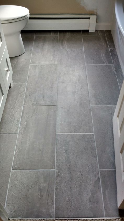 Bathroom renovation complete with grey large format tile with contrast grout lines. Large Tile Bathroom, Grey Bathroom Floor, Laundry Room Tile, Grey Bathroom Tiles, Grey Floor Tiles, Tiled Floor, Bathroom Redesign, Large Tile, Large Format Tile