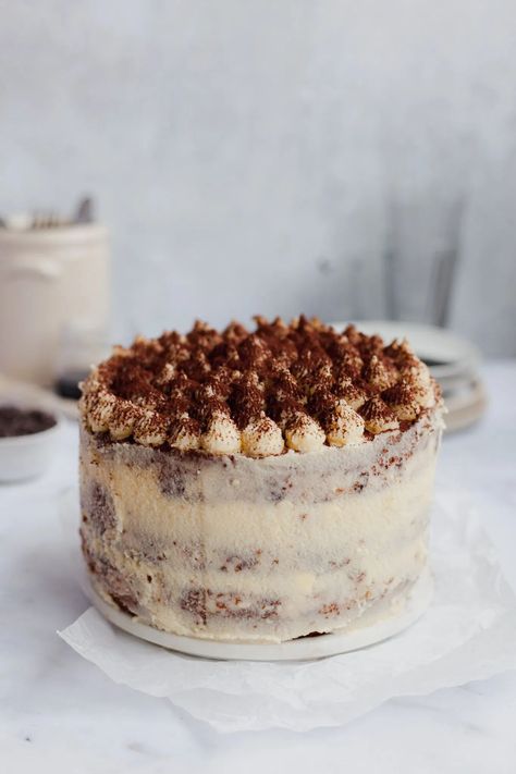 This tiramisu layer cake has a yellow sponge soaked with coffee syrup, a coffee ganache, and frosted with mascarpone buttercream Mascarpone Buttercream, Coffee Ganache, Tiramisu Cake Recipe, Layer Cake Recipes, Tiramisu Cake, Tiramisu Recipe, Coffee Syrup, Moist Cakes, Italian Desserts