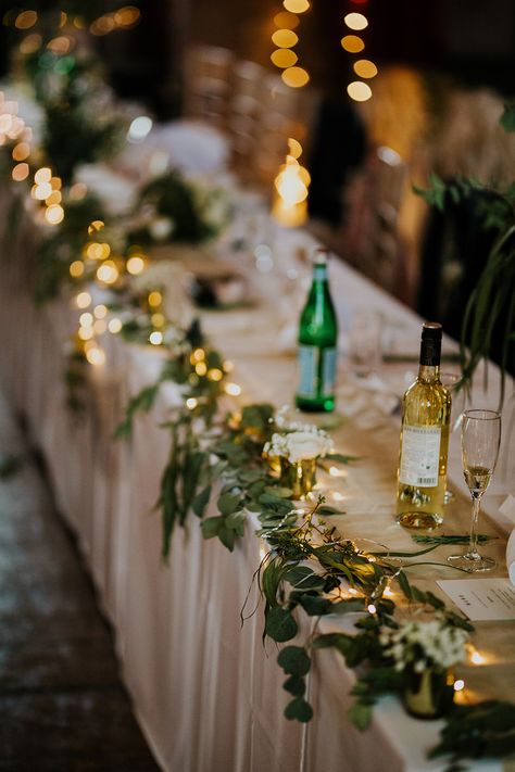 Table Runner Garland Swag Greenery Fairy Lights Scandi Foliage Wedding Ross Alexander Photography #Flowers #Greenery #Foliage #wedding #runner #garland #gold #fairylights #candles #tables Table Fairy Lights, Wedding Table Lighting, Fairy Lights Wedding, Wedding Runner, Lighted Centerpieces, Wedding Reception Planning, Table Garland, Lights Wedding, Foliage Wedding