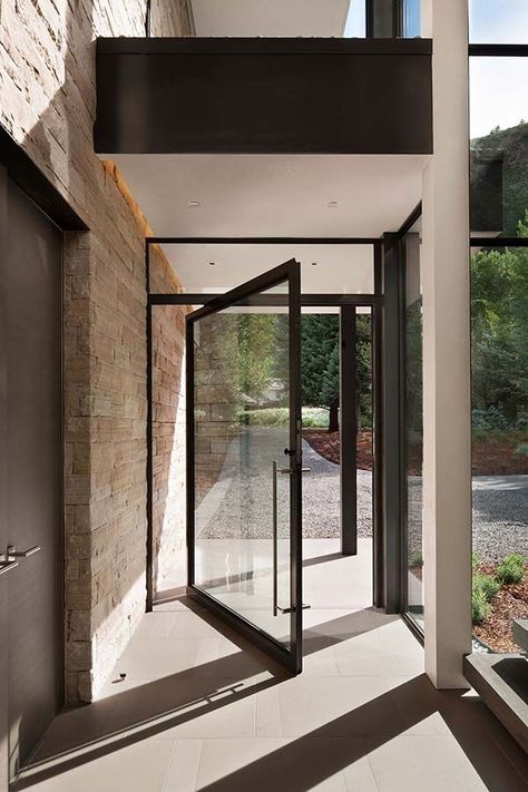 Stone and glass home in Aspen surrounded by trees Door Architecture, Street Dreams, Exterior Entry Doors, Prairie House, Pivot Door, Lan Can, Pivot Doors, Glass Front Door, Luxe Interiors