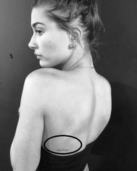 Hailey Baldwin Tattoo, Side Back Tattoos, Back Tattoo Placements, Celebrity Tattoos Women, Tiny Tattoo Placement, 27 Tattoo, Small Back Tattoos, Stephen Baldwin, Tiny Heart Tattoos