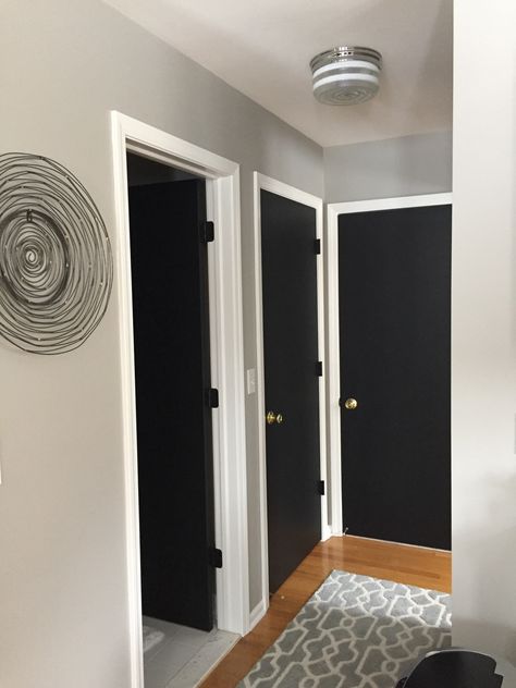 Black Interior Doors With White Trim Gold Hardware, Black Doors Hallway White Trim, Black Door Frames White Doors, Flat Panel Black Doors, Black Interior Doors Small House, Black Stain Door Interior, Black Indoor Doors Bedroom, Hall With Black Doors, Cream Walls White Trim Black Doors