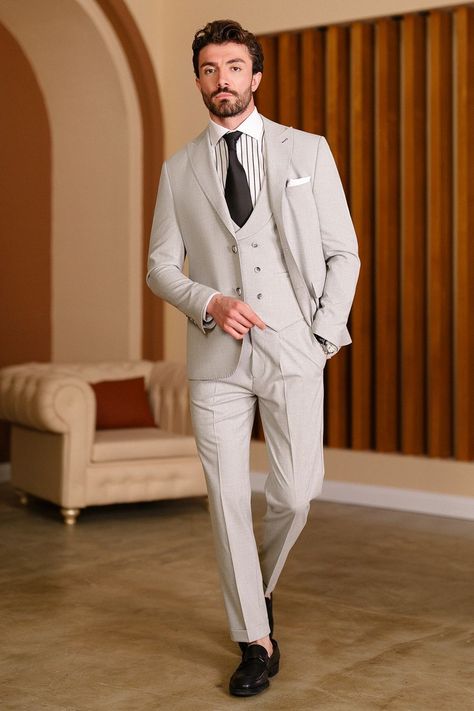 Step into refined elegance and tailored excellence with the Grey Slim-Fit Suit 3-Piece from VIOSSI. Designed for the discerning man, this ensemble's precise slim fit and classic peak lapels exude a timeless aura of professional distinction. #menssuits #tailoredstyle #professionalattire #moderngentleman #VIOSSI #tailoredsuits #sophisticatedlook #mensfashion #sartorialexcellence #peaklapels Grey Slim Fit Suit, Suit Styles, Double Breasted Tuxedo, Suit Stores, Slim Fit Suit Men, Slim Fit Tuxedo, Navy And Khaki, Slim Fit Suits, Slim Fit Suit