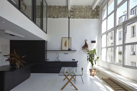 A Renovated Loft in Paris by a Young Architect on the Up - Remodelista Diy Terrazzo, Paris Loft, Terrazzo Table, Mid Century Bedroom, Eichler Homes, Industrial Interiors, Dark Interiors, Paris Apartments, Pink Kitchen