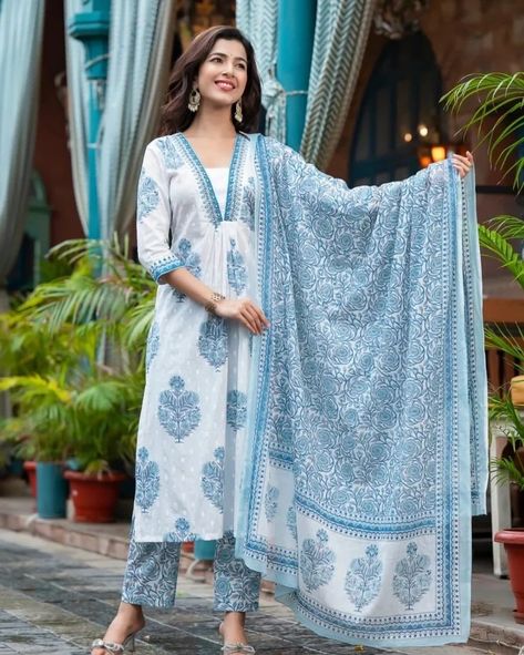 Exquisitely crafted, the Kalina Blue Handwork Suit Set offers a luxurious experience - the perfect pick for any festive occasion. White buta print and embroidery make an eye-catching combination, while a floral jaal print dupatta exudes refined elegance Rendered in the finest cotton, this suit set will have you looking and feeling your absolute best. Fabric - Pure 60/60 Cotton with Cotton Dupatta and with Lining in Kurta Sizes : M/38 , L/40 , XL/42 and XXL/44 PRICE - 950/-+Ship Extra ... Cotton Suit Designs, Churidar Neck, Long Tunic Dress, Straight Cut Pants, Desi Fashion Casual, Cotton Kurti Designs, Cotton Dupatta, Stylish Pants, Ethnic Dress