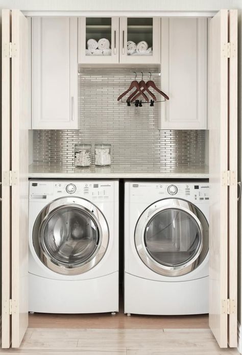 Laundry Room Closet Design Idea, Remodelista - this is about the same size as my laundry area but much more stylish! Laundry Room Ideas Closet Hanging Clothes, Laundry Room Ideas With Hanging Rod, Laundry Room With Bar To Hang Clothes, Small Laundry Area In Kitchen, Laundry Cabinet With Hanging Rod, Washer And Dryer Small Space Ideas, Kitchens With Laundry Area, Laundry Closet Open Shelving, Laundry Room Upper Cabinets With Rod