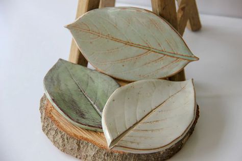 These beautiful handmade leaf soap dishes are a great way to add that special touch to your bathroom or kitchen. They also make perfect spoon-rests! • handmade leaf soap dish • Large 7”x4”, also available in small on different listing • leaf imprint • customizable color • beautiful, unique gift • dishwasher, microwave and oven safe Pottery Sale, Florida Art, Spoon Rests, Soap Dishes, Elegant Tattoos, Oyster Shell, Soap Dish, Clay Projects, Moss Green