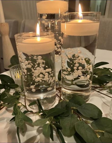 Elegant Banquet Ideas, Wedding Table Floating Candle Centerpieces And Eucalyptus, Floating Pearls Centerpiece, Mirror Candle Centerpiece, Center Pieces With Candles And Fsiry Lights, Candle Centerpieces Floating Pearls, Pearl Wedding Centerpieces, Wedding Guest Table Centerpieces, Cylinder Vase Centerpiece