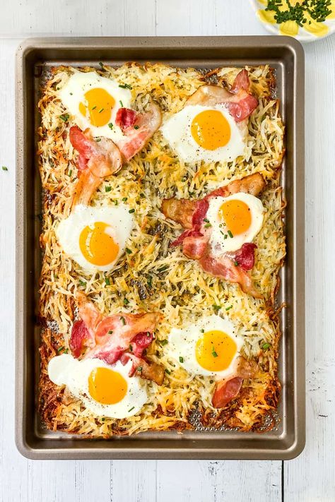 An easy Sheet Pan Breakfast for cozy weekends or weekday mornings when you need something extra. A full breakfast of eggs, bacon, and crispy hashbrowns-- in one pan. #breakfast #sheetpan #eggs #hashbrowns #31Daily Hashbrown Recipes Sheetpan, Hashbrown Sheet Pan Breakfast, Hashbrown Bacon Egg Sheet Pan, Eggs On Hashbrowns, Sheet Pan Bacon And Eggs, Breakfast One Pan, Easy Sheet Pan Breakfast, Sheet Pan Hashbrown Breakfast Bake, Sheet Pan Eggs And Hashbrowns