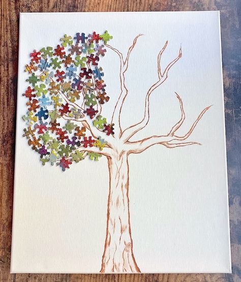 How to create a whimsical leafy tree with colorful small puzzle pieces! This easy puzzle piece craft is a creative way to make DIY wall art in your home that you can actually be proud of. Puzzle Crafts Wall Art, Puzzle Piece Tree Craft, Craft With Puzzle Pieces, Puzzle Decorations Wall Art, Puzzle Piece Art Project, Painting On Puzzle Pieces, Easy Puzzle, Puzzle Piece Art, Puzzle Piece Crafts