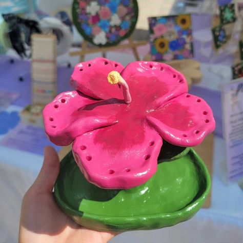 Pink Hibiscus Jewelry Holder🌺 This beautiful hand sculpted, painted & glazed piece can hold 12 pairs of earrings and has a jewelry dish at the bottom for any rings, bracelets, or trinkets. Only one is available! So let me know if you would like me to reserve it for you. #hibiscus #jewelryholder #earringholder #jewelrydish #clayart #handmade #handpainted #glazedclay #flowerart #hibiscusart Hibiscus Jewelry, Bracelet Holder, Bracelet Holders, Pink Hibiscus, Earring Holder, Rings Bracelets, Jewelry Dish, Jewelry Holder, Clay Art