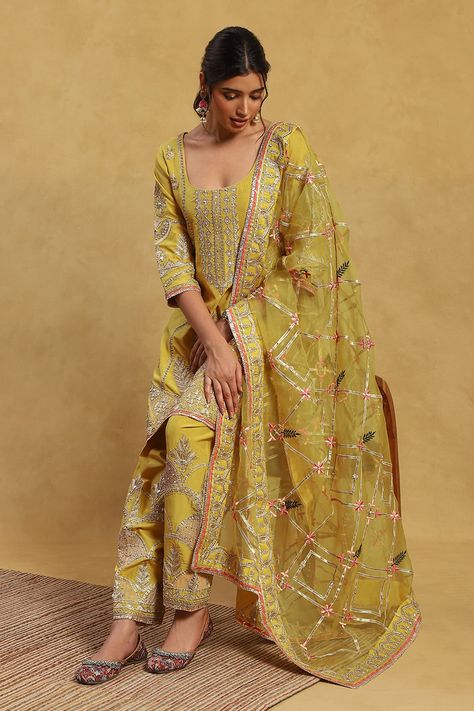 Yellow kurta with all over floral, vintage pattern, contrast metallic gota, thread, bead and zari embroidery. Paired with embroidered salwar and dupatta with cut work lace border. - Aza Fashions Embroidered Salwar, Yellow Kurta, Dupatta Style, Clothing Store Interior, Indian Princess, Kurta Pant Set, Velvet Dress Designs, Zari Embroidery, Punjabi Outfits