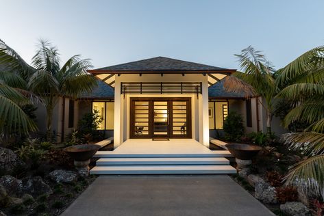 The residence was designed in 2016 by the Arcline Architecture team, after being approached by the owners who wanted a home that was Balinese styled yet was functional and practical & maximised the views of the Kerikeri Inlet, with the stunning Bay of Islands in the distance. Modern Garage, Entry Way Design, Tropical House, Entry Gates, Entrance Design, Modern Tropical, Outdoor Entertaining Area, Tropical Houses, Garage Design